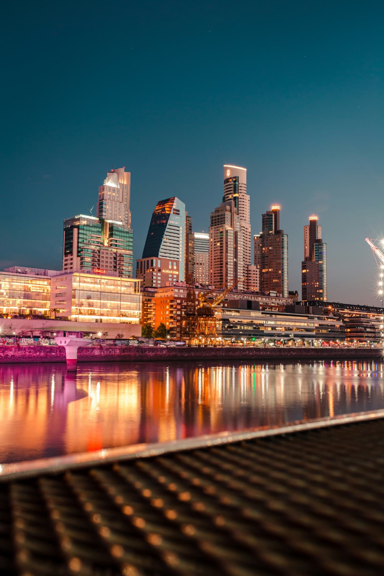 The Buenos Aires skyline reflected in the water at Puerto Madero after dark