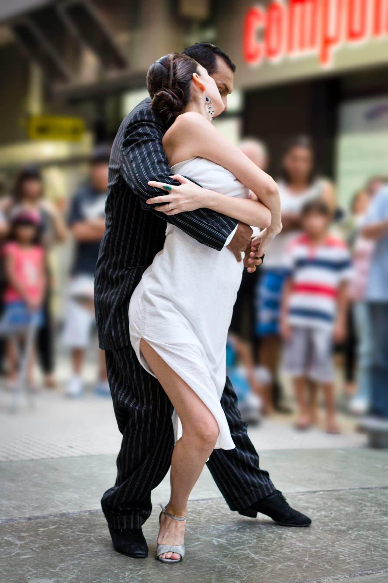 A couple dancing tango on a Buenos Aires street